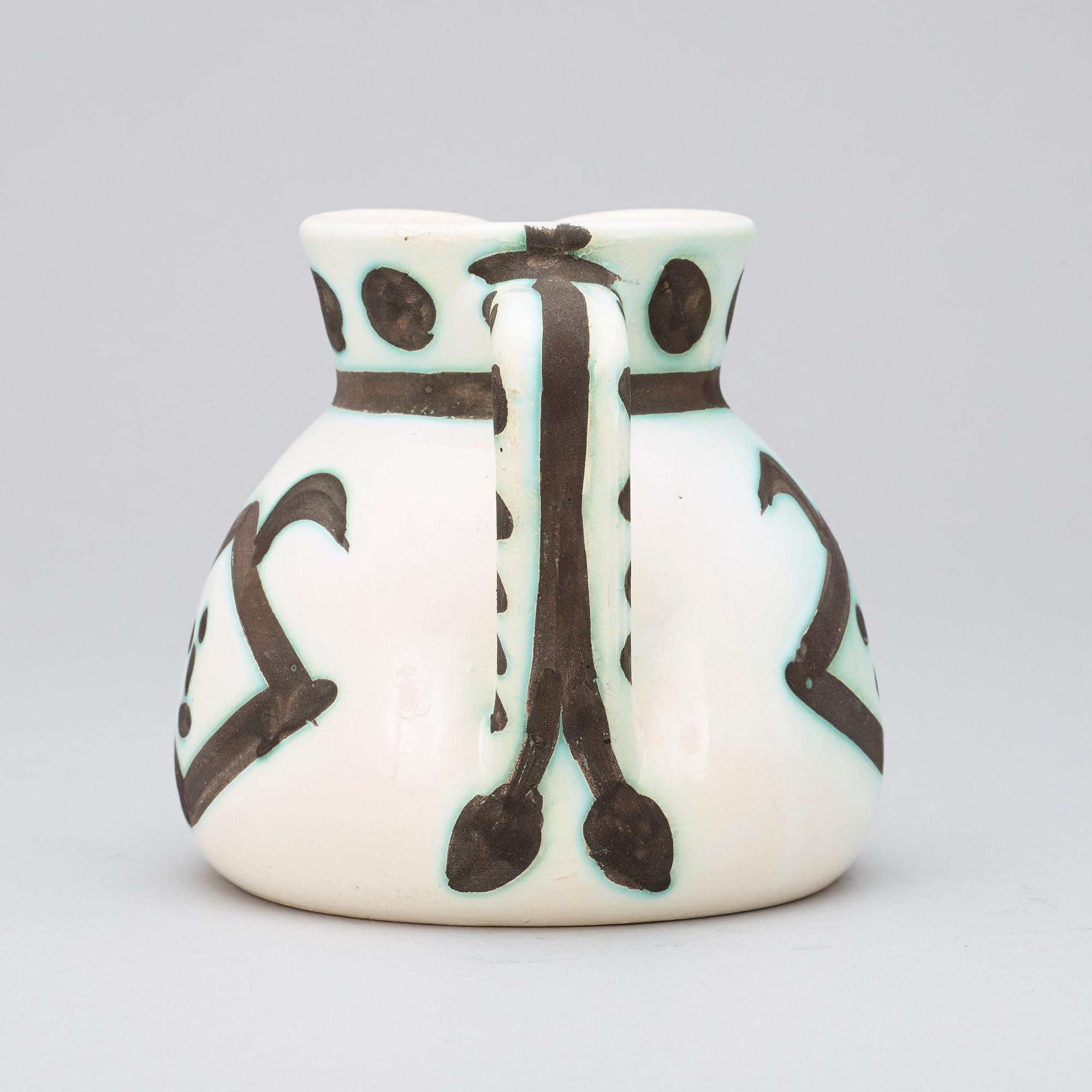 A Pablo Picasso 'Têtes' pitcher, Madoura, Vallauris, France 1956.
