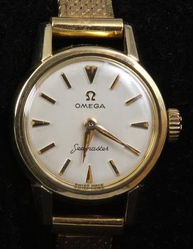 DAMARMBANDSUR, Omega, "Seamaster", 1900-talets mitt. Mestadels guld.