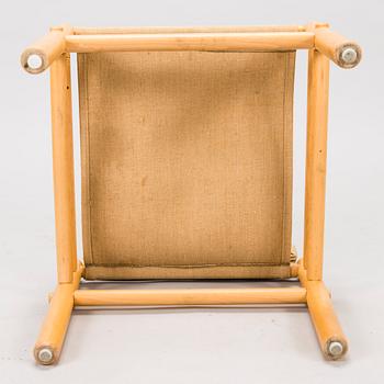 BROR BOIJE, A pair of 'Junker' easy chairs and an ottoman for Dux, Sweden, latter half of the 20th Century.