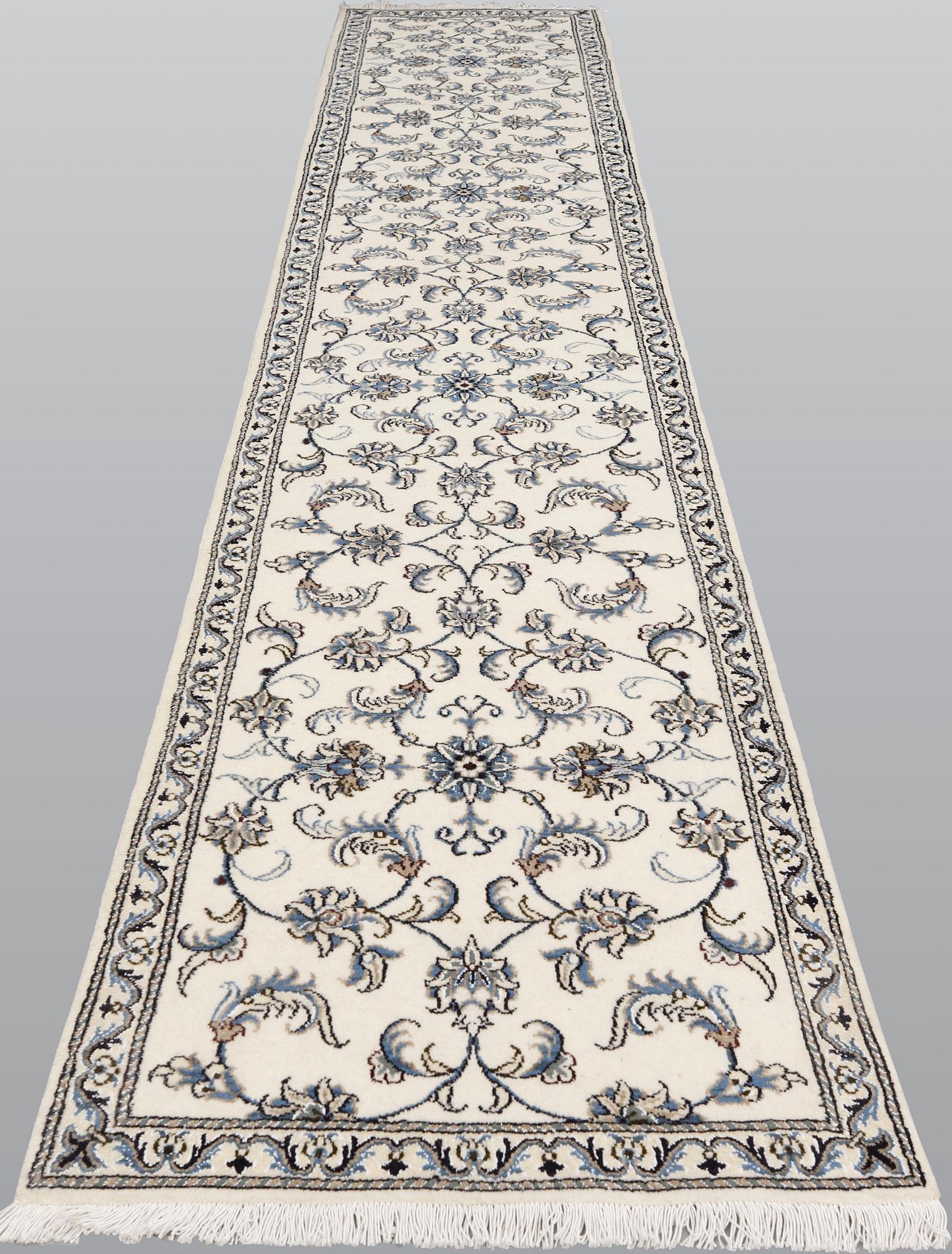 A Nain runner, part silk, c. 394 x 75 cm.