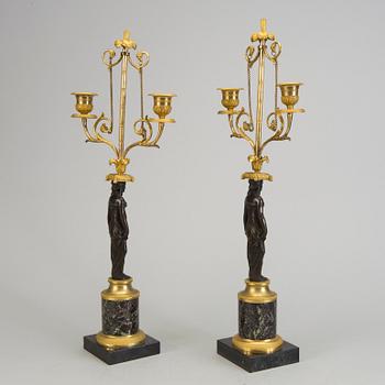 A pair of 1800s empire candelabras.