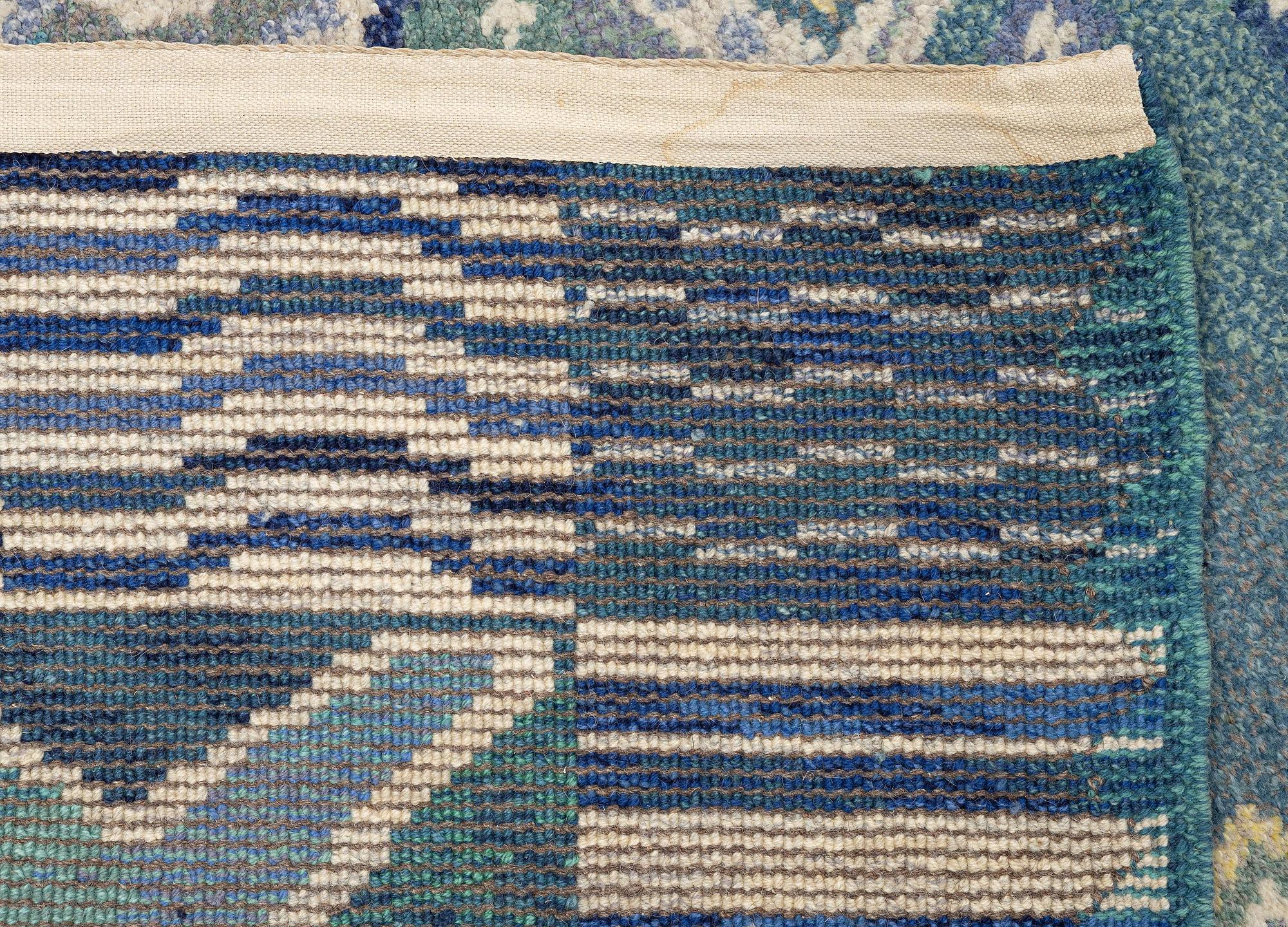 Margareta Sundbom Eichenholz, a knotted pile, 'Skogen och älven' carpet, Gävleborgs Läns Hemslöjdsförening, c. 710 x 384 cm.