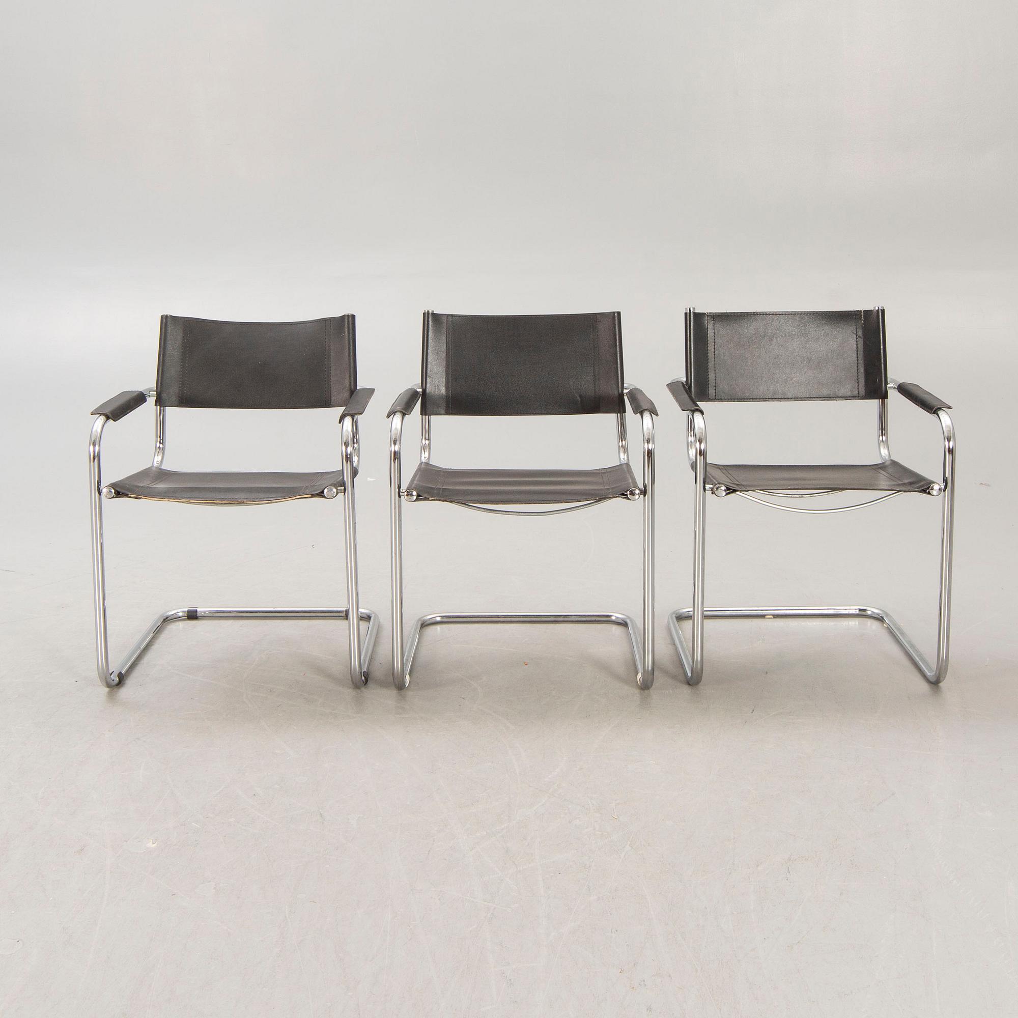 A set of five similar Italian 1970s chrome and leather armchairs.