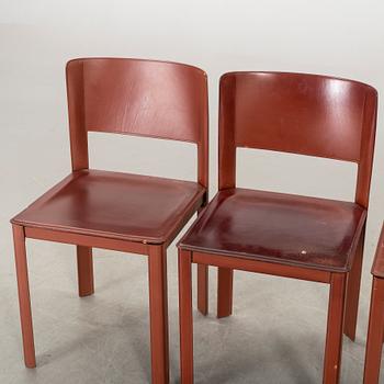 MATTEO GRASSI, a set of four leather chairs.