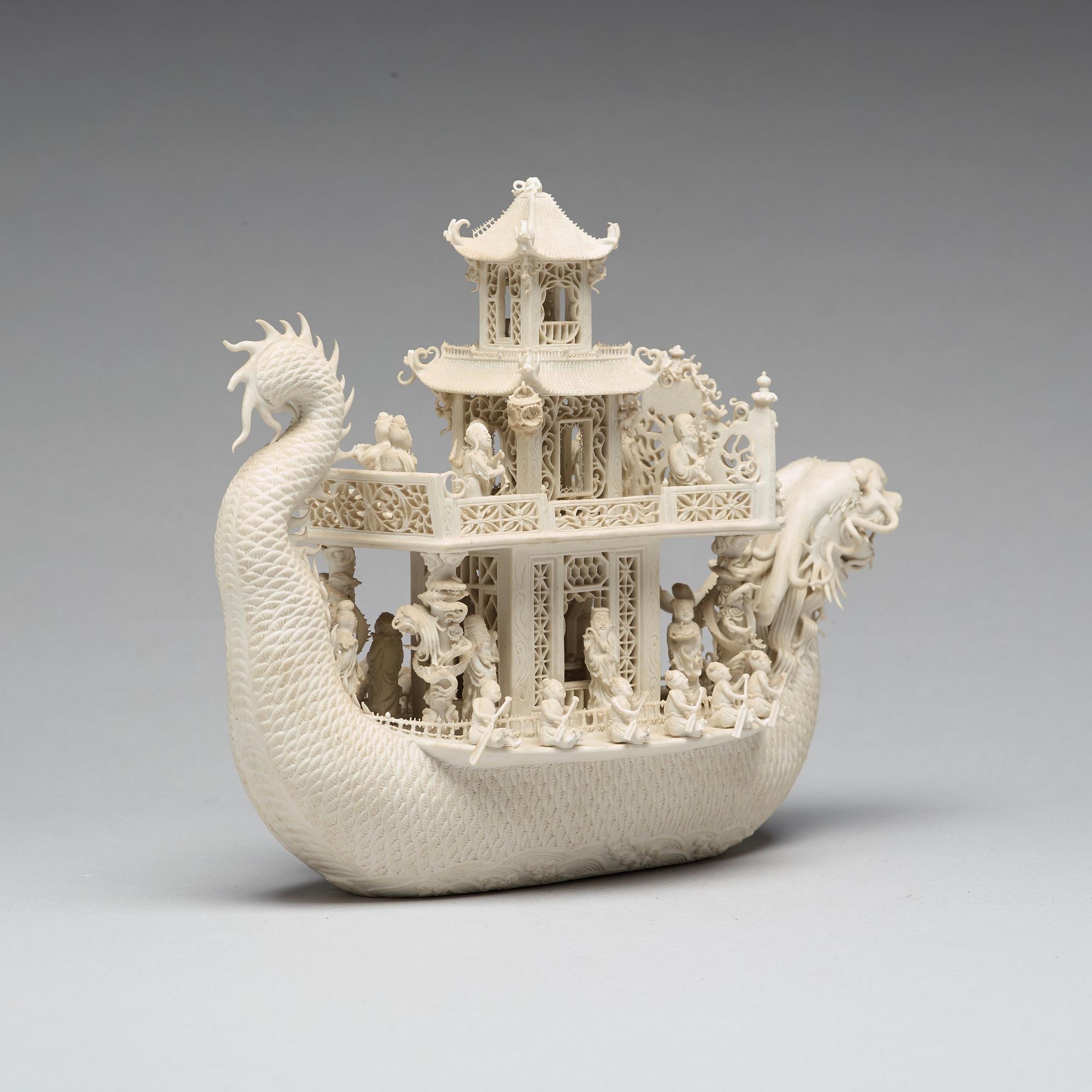 A biscuit porcelain dragon boat of 'Assembly of Immortals', Qing dynasty, Daoguang, signed Chen Guozhi, 19th century.
