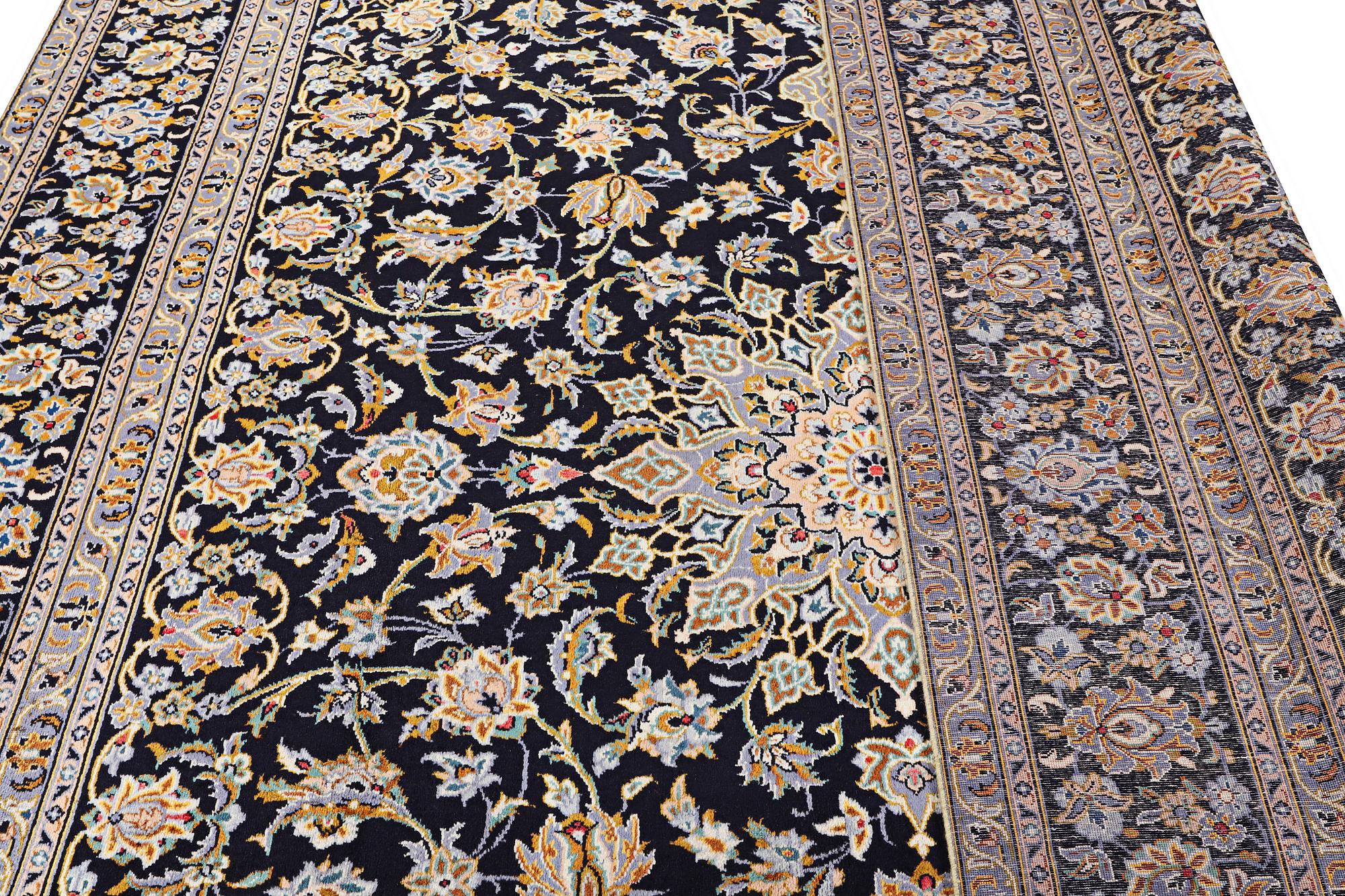 A Kashan carpet, signed, c. 410 x 270 cm.