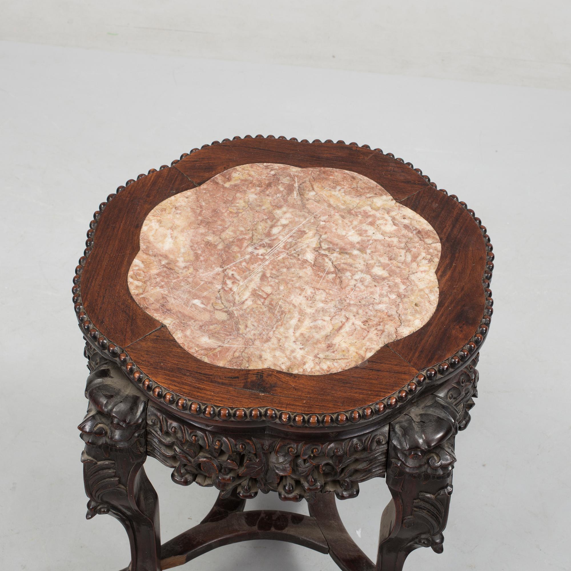 A Chinese hardwood table with marble top, 20th Century.