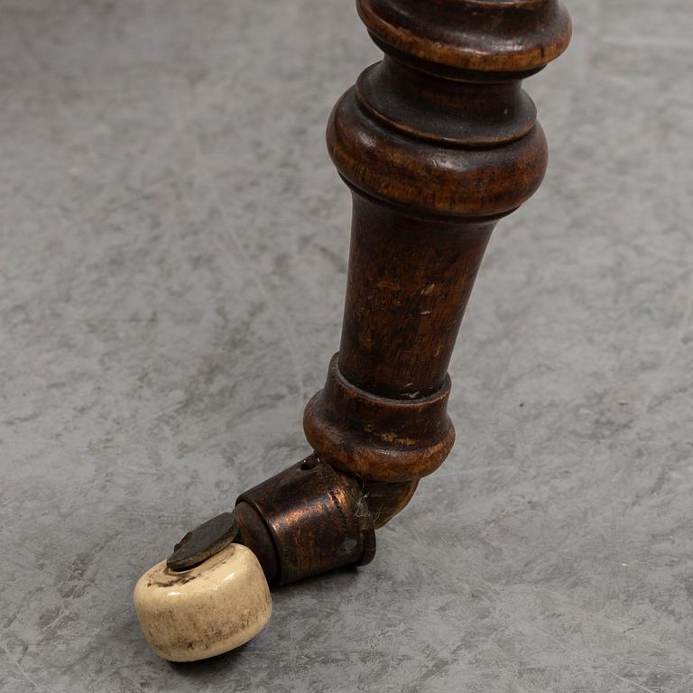 A 19th Century drop leaf table.