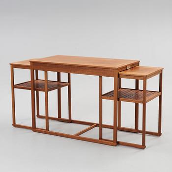 A Carl Malmsten teak set of occasional tables.