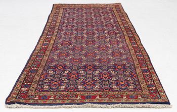 A oriental rug, c. 295 x 108 cm.