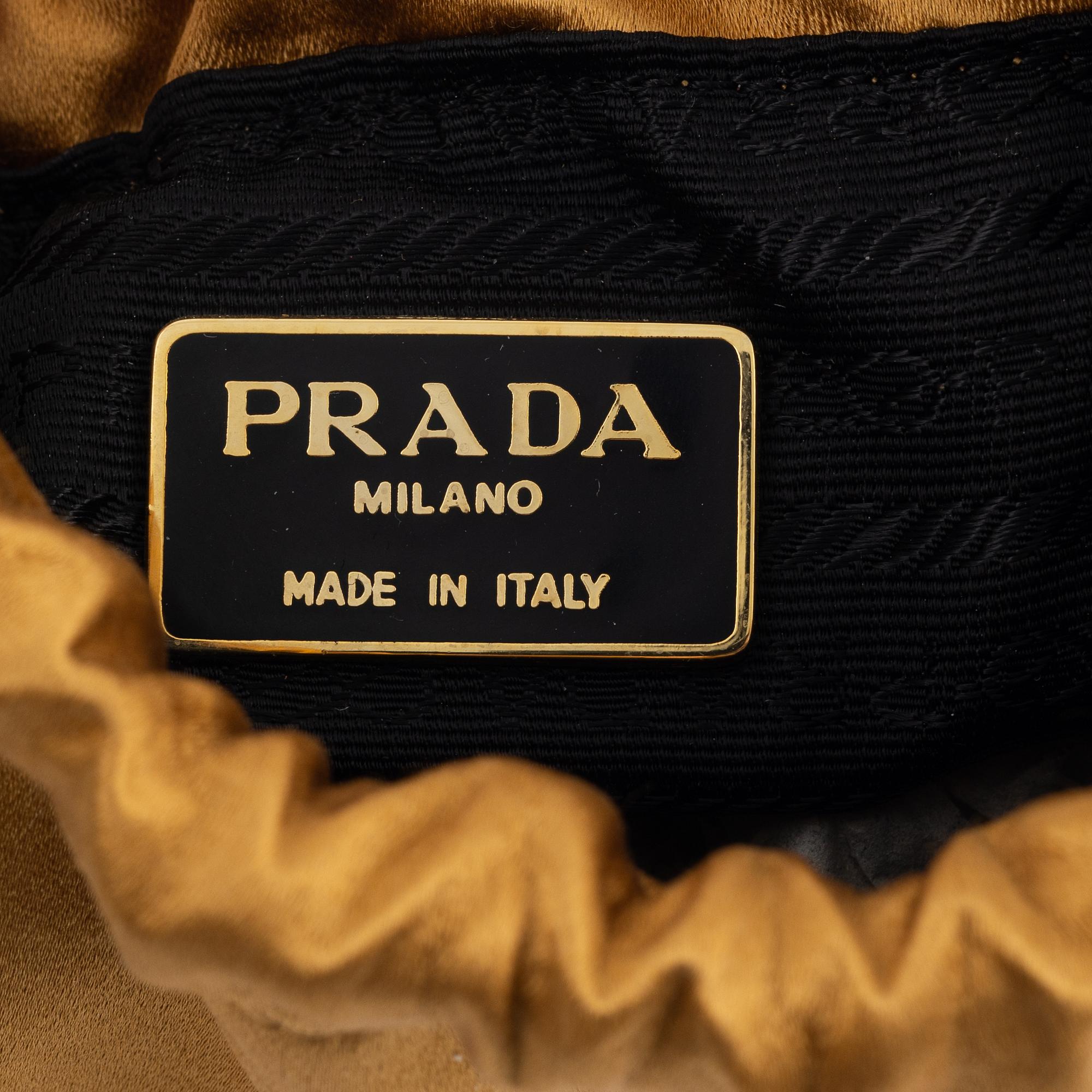 Prada, a satin bag.