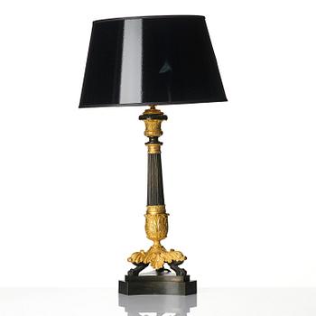 A French Louis Philippe ormolu and patinated bronze lamp, first part 19th century.