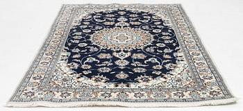 A Nain carpet, c. 255 x 150 cm.