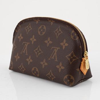 Louis Vuitton, makeup bag and wallet.