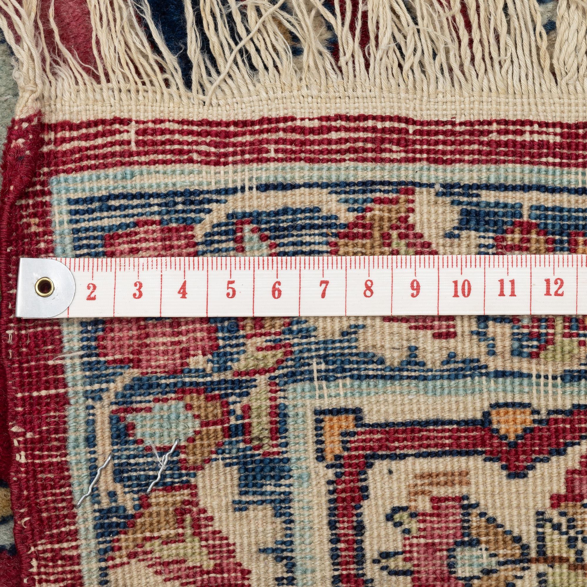 An antique Kerman Raver rug, ca 225 x 141 cm.