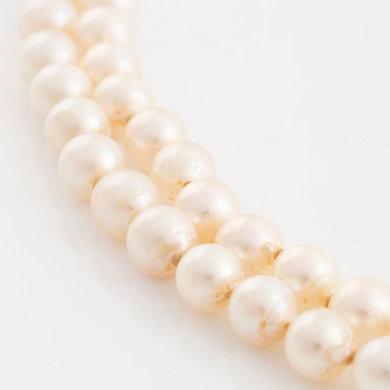 Two strand cultured pearl necklace, 18K gold clasp with rutile quartz.