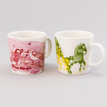 HEINI RIITAHUHTA, Two signed porcelain mugs 'Love' and 'Happy', Arabia Finland.