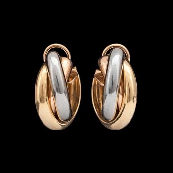 1249. A pair of Cartier gold earrings.