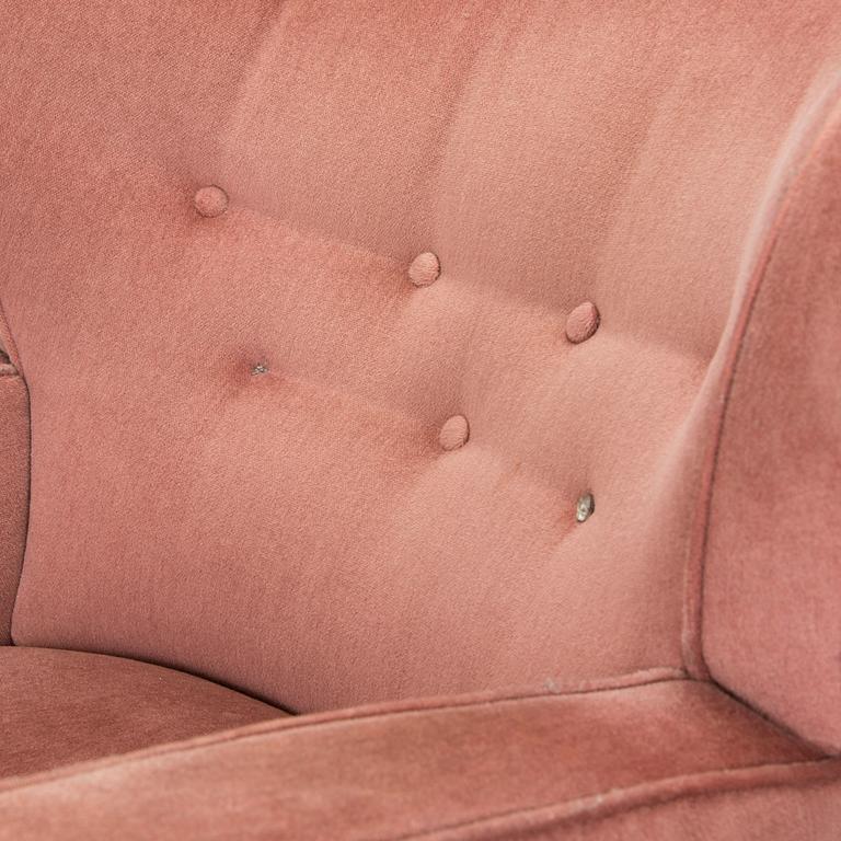 A pair of mid-20th century armchairs.