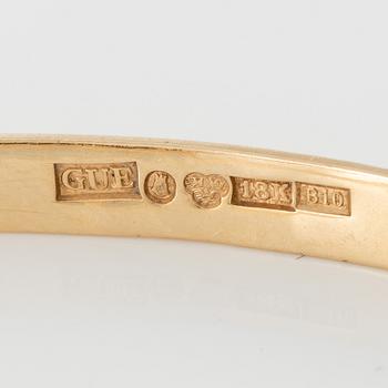 Bracelet 18K gold with green stone.