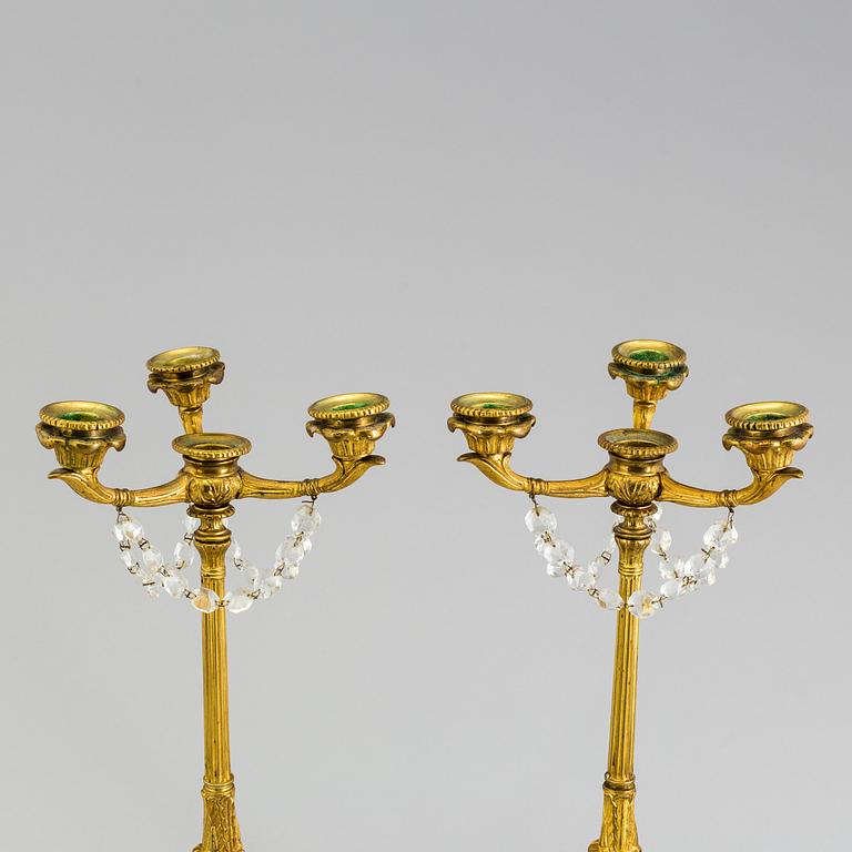 A pair of neorenaissance candelabras, about 1900.