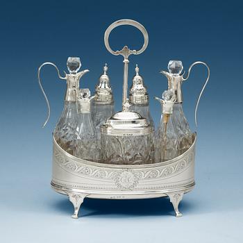 920. An English 18th century silver and glass cruet-set, unidentified makers mark, London 1797.
