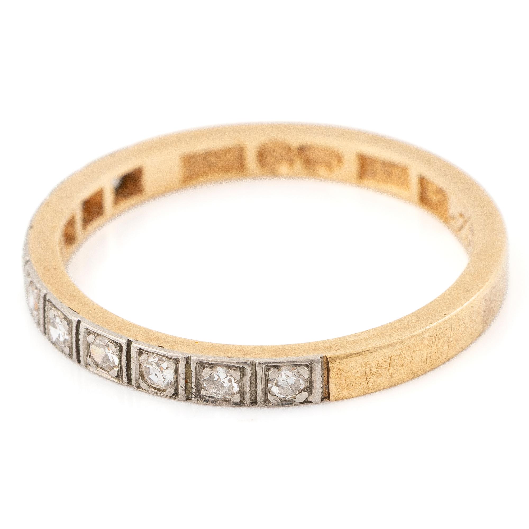 18K gold half-eternity ring with octagonal-cut diamonds.