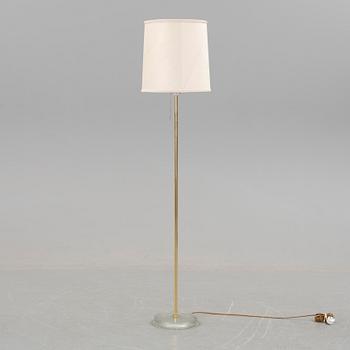 A brass floorlamp with a glass base, from 1970/80s.