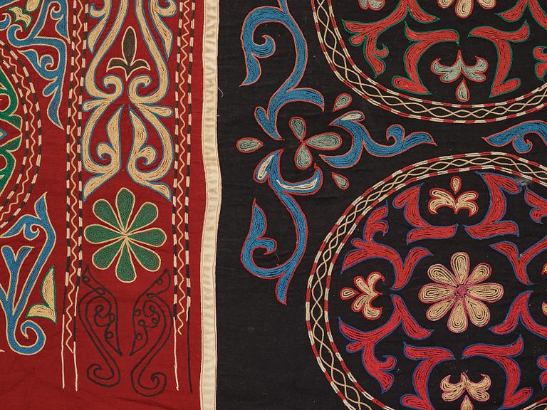 A Suzani textile, ca 247 x 128 cm.