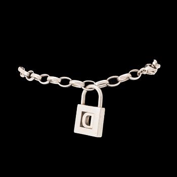 Tiffany & Co a silver pendant with accompanying bracelet.