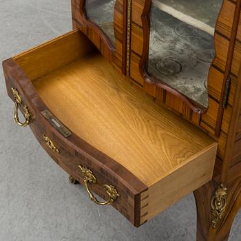 A late 19th century rococo style cabinet.