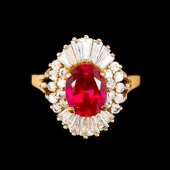 1416. A 1970s golden ring with red decorative stone by Christian Dior.