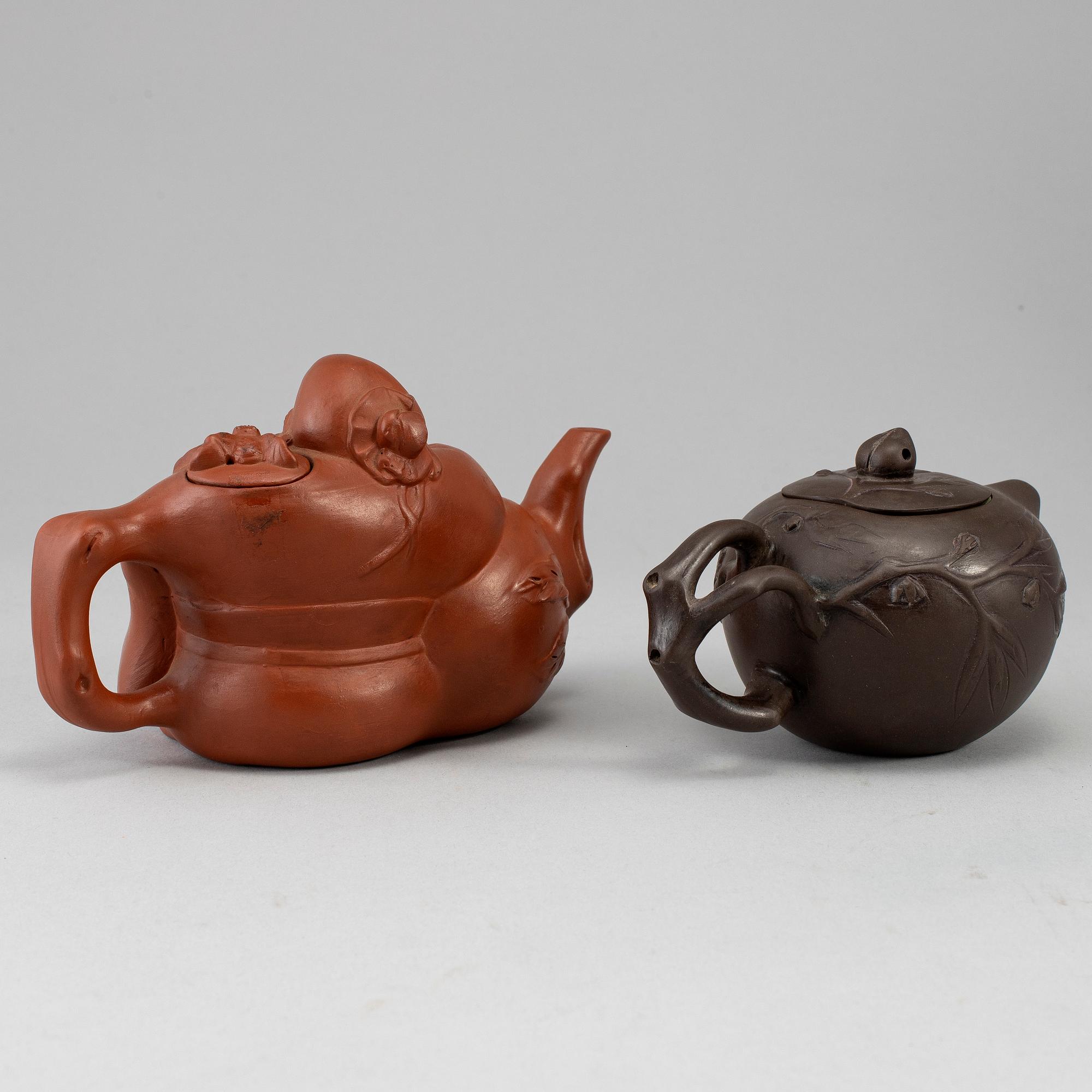 Two Yixing tea pots with cover, China, 20th Century.