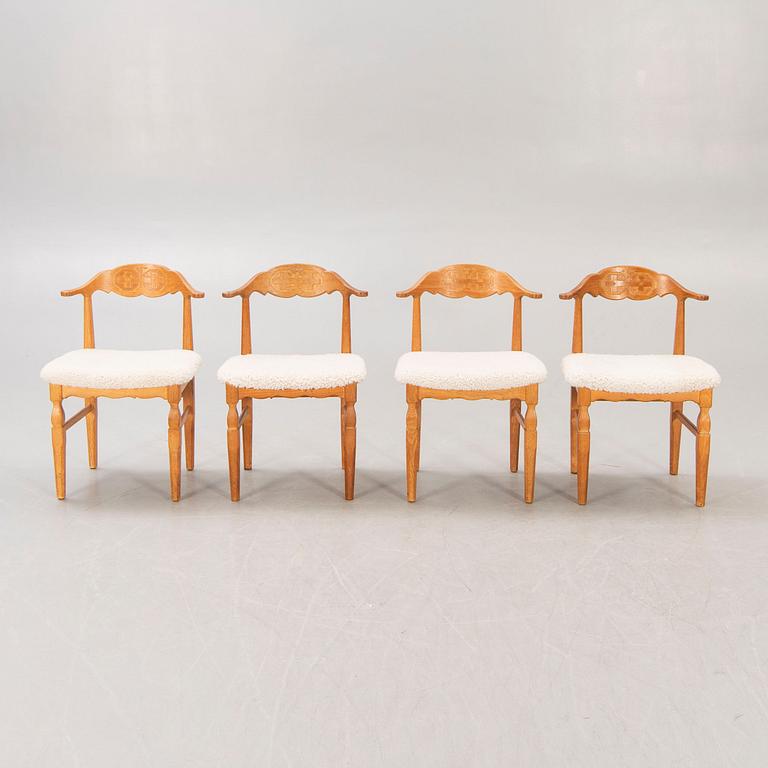 A set of 14 Henning Kjaerulf 1950s oak chairs.