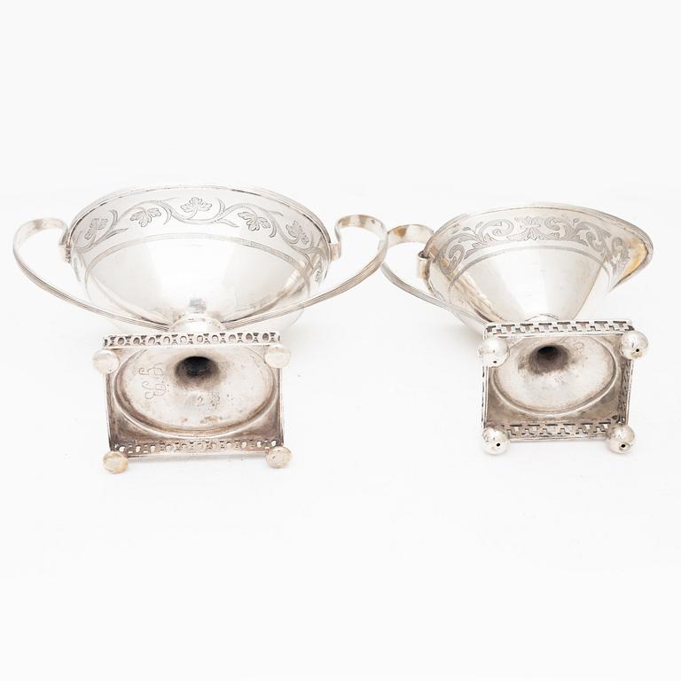 A silver sugarbowl with lid and a creamer, marks of Olof Hellbom, Stockholm, Sweden 1799-1800.