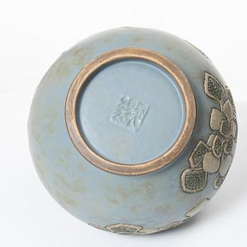 A blue glazed relief vase, possibly Korea, around 1900.