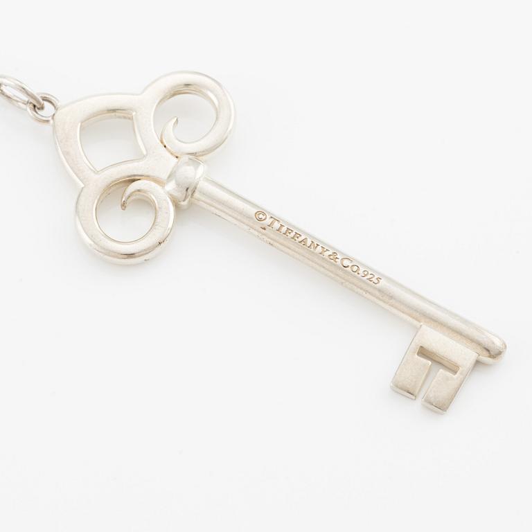 Tiffany & Co, "Fleur de lis key" pendant key with chain, sterling silver.