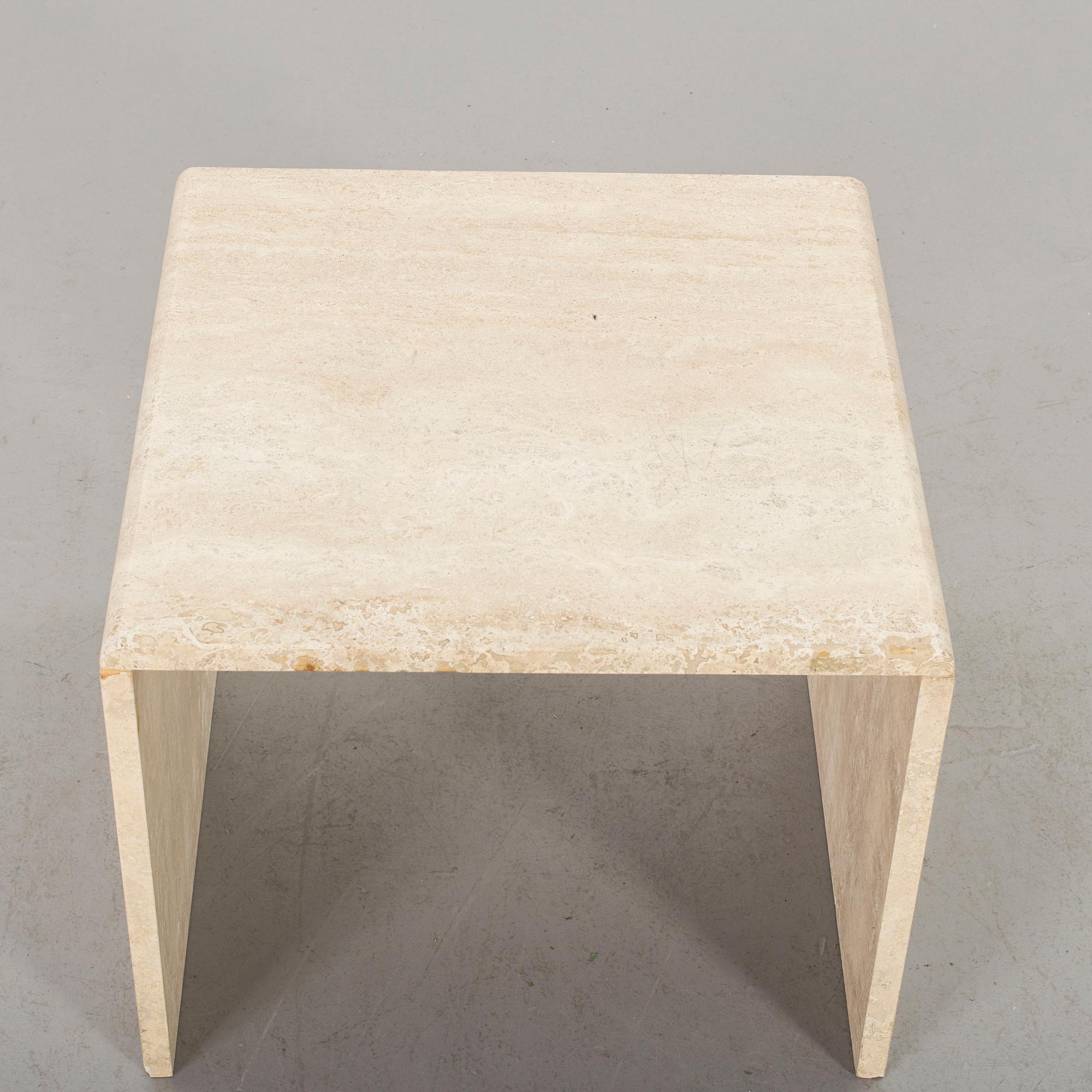 A TRAVERTINE SIDE TABLE.