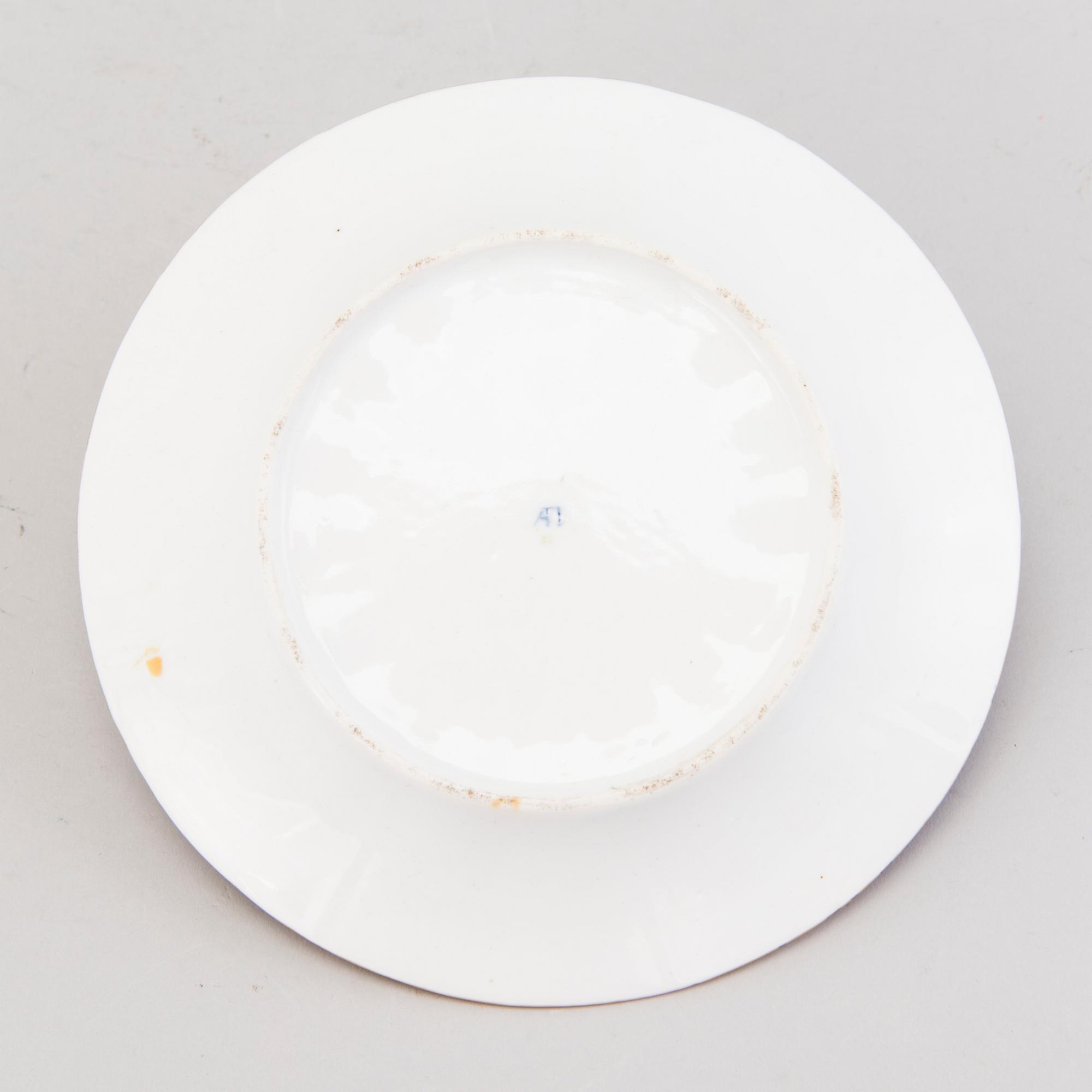 A Popov porcelain cup with saucer, Russia mid-19th Century.