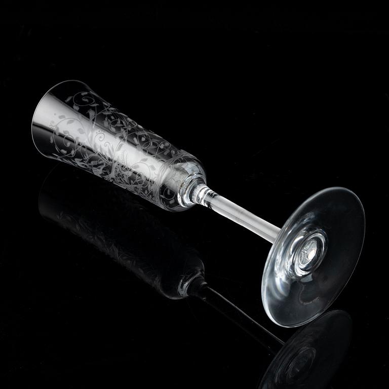 A set of 18 champagne flutes, engraved with animals and leafwork, 20th century Europe .