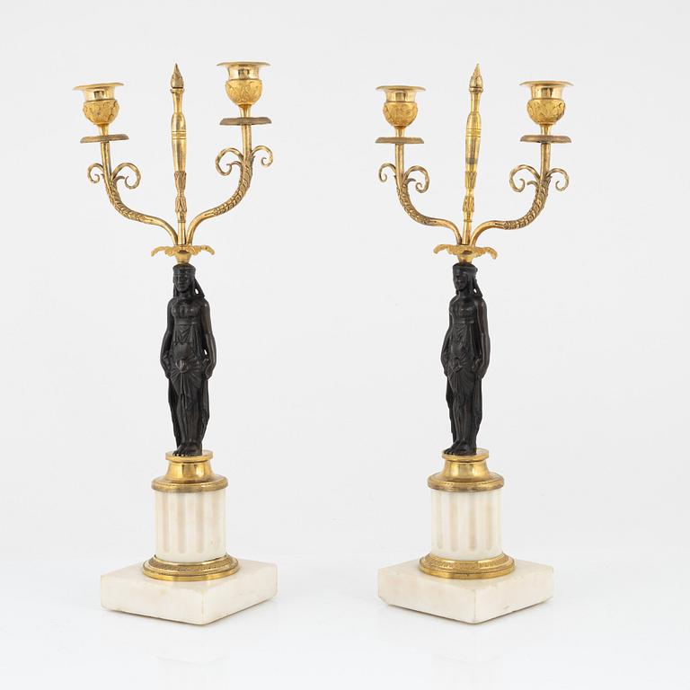 A pair of French Louis XVI two-light marble and ormolu candelabra, late 18th century.