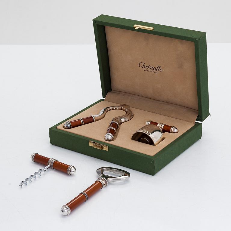 A French four-piece Christofle bottle opener and stopper set, of which two in original box.