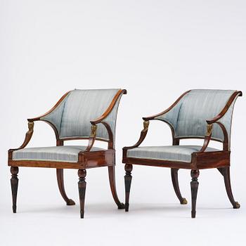 A pair of late Gustavian mahogny armchairs.