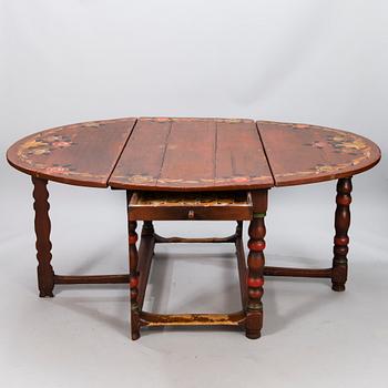 A painted 18th Century Baroque gate leg table.