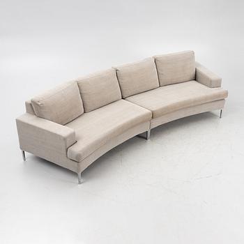 A 'Curve' sofa with a foot stool, Ire, 21st Century.