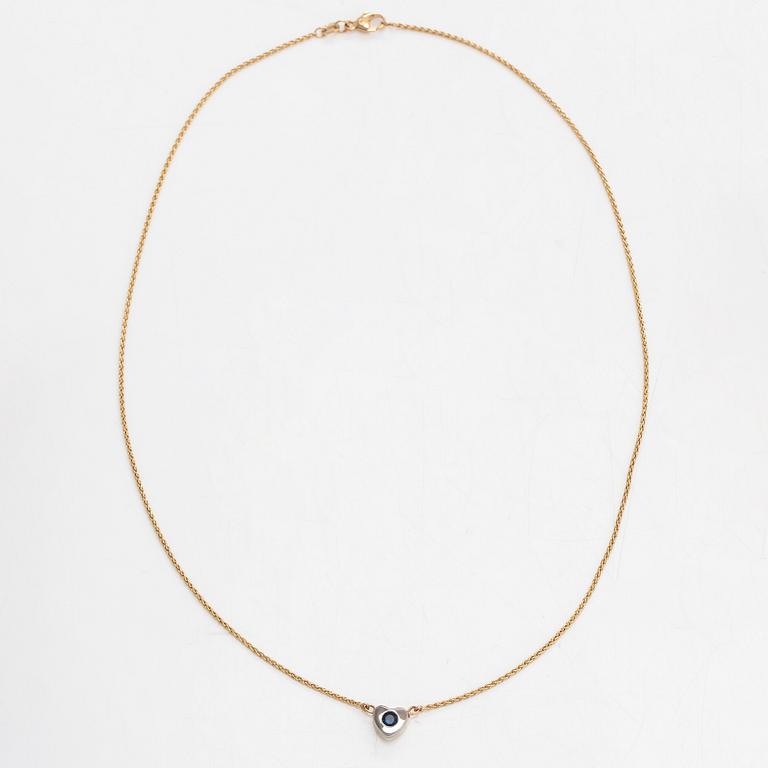 Halsband, 14K guld, hjärtformat hänge med en safir och rubin. Finska import stämplar.