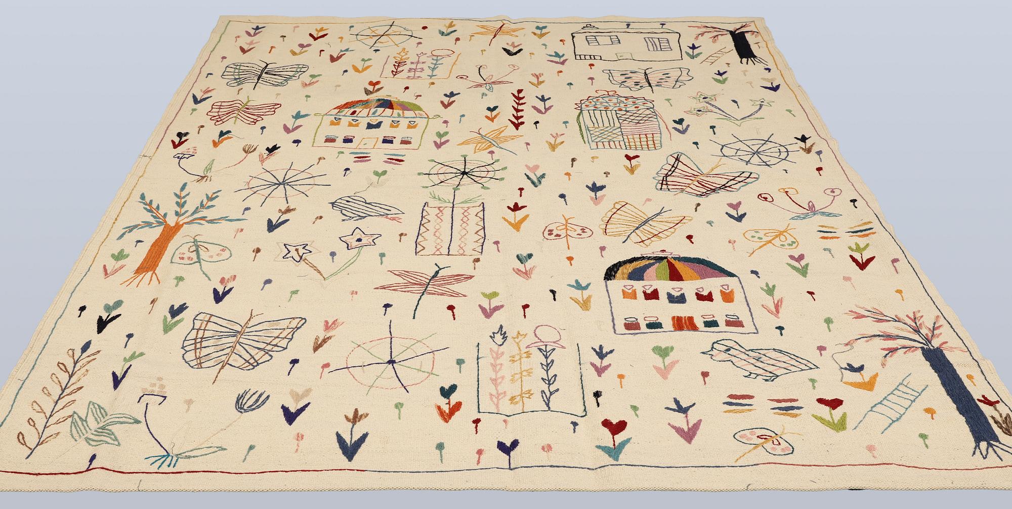 A hand-embroidered Kilim rug, approx. 244 x 180 cm.
