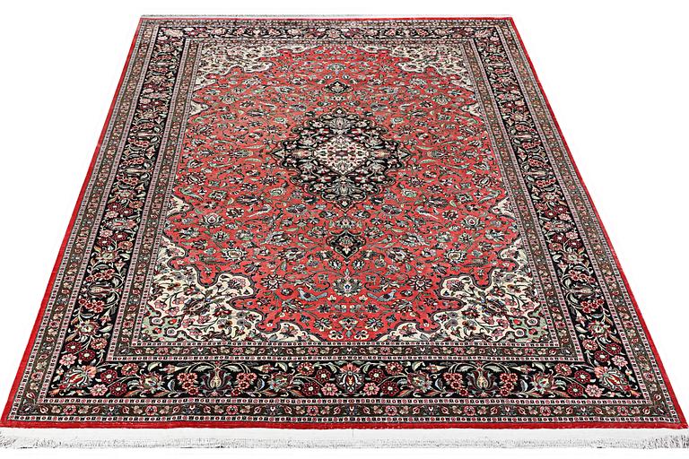 A silk Quum carpet, c. 305 x 205 cm.