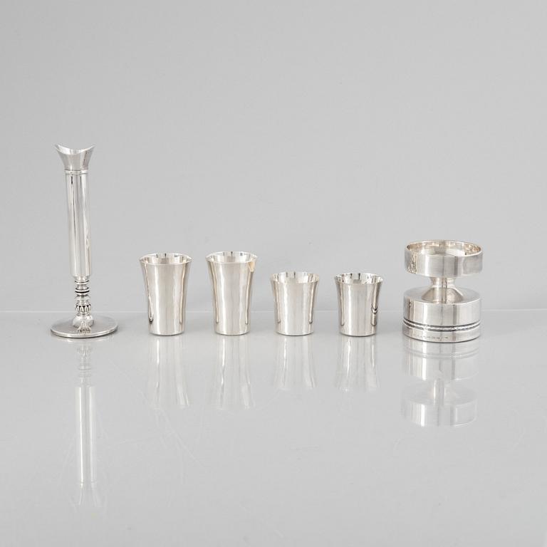 Eric Löfman, a Swedish silver candlestick, a vase and four cups, including MGAB, Uppsala 1977.