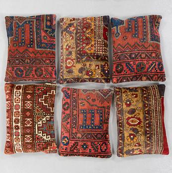 Six pillows made from rugs.